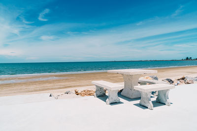 Scenic view of beach against blue sky