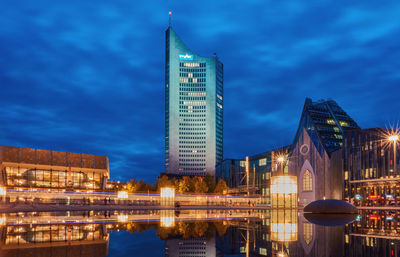 Illuminated buildings in city at night