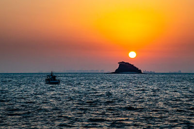 Scenic view of sea against sky during sunset