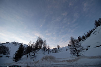 Scenic view of snow covered mountains against sky