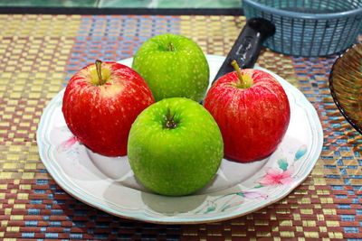 High angle view of apples in plate on table