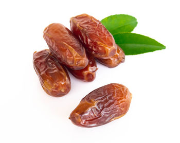 Close-up of fruits against white background