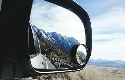 Mountain range against cloudy sky