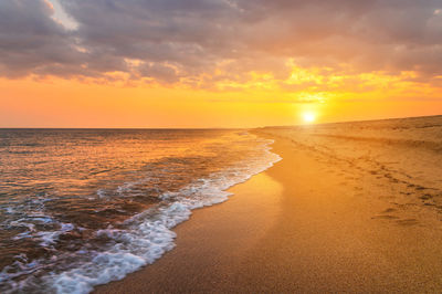 Scenic view of sea against sky during sunset