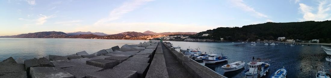 Panoramic view of bay against sky