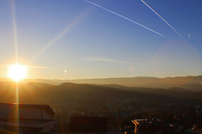 Scenic view of mountains against sky at sunset