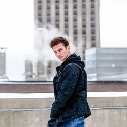 Portrait of teenage girl standing in city