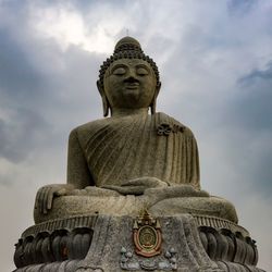 Low angle view of statue against sky
