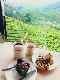 Various food on table against mountains