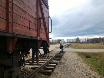 View of a cropped train against clouds