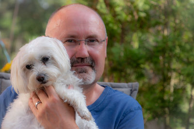 Portrait of man with dog