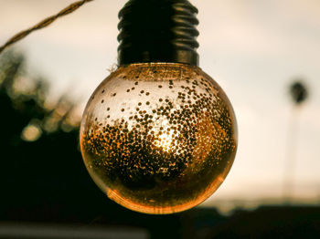 Close-up of christmas decorations hanging on metal