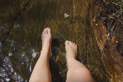 Low section of woman in water