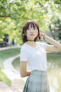 Portrait of a teenage girl standing outdoors