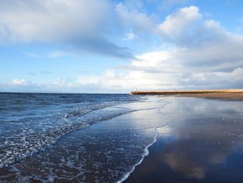 Scenic view of sea against sky during winter