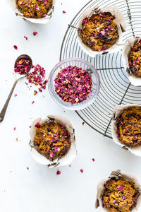 Homemade keto morning glory muffins garnished with edible rose petals.