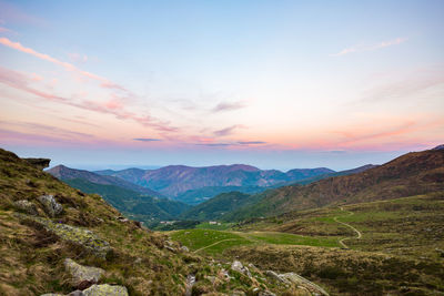 Scenic view of mountains against sky during sunset