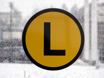 Close-up of letter l on wet glass