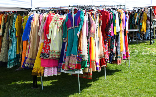 Multi colored umbrellas hanging in rack