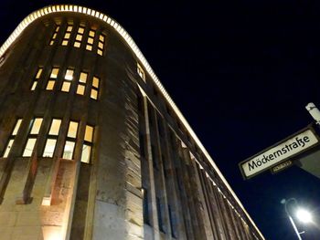 Low angle view of illuminated building at night