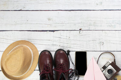 High angle view of shoes on wooden floor