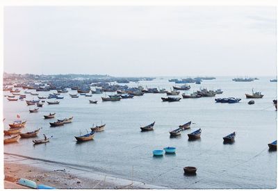 High angle view of boats on sea against sky