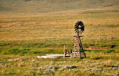 Traditional windmill on field