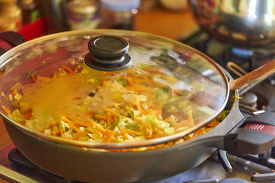 High angle view of food in cooking pan on stove