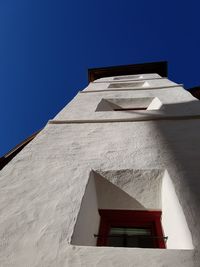 Low angle view of building against clear blue sky