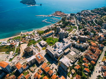 High angle view of buildings and sea in city