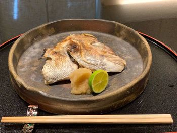 Close-up of fish served in plate on table