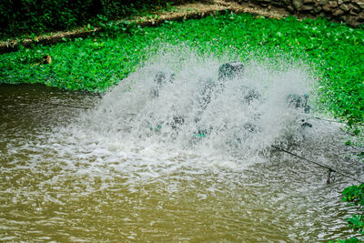 High angle view of water splashing in sea