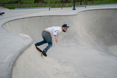 Full length of man skateboarding on skateboard