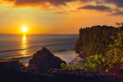 Scenic view of sea against sky during sunset