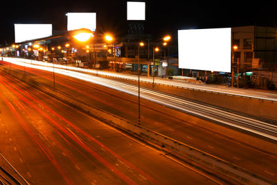 Light trails on street in city at night