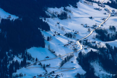 Aerial view of snowcapped mountain and road against sky