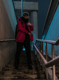 Full length of man standing on staircase