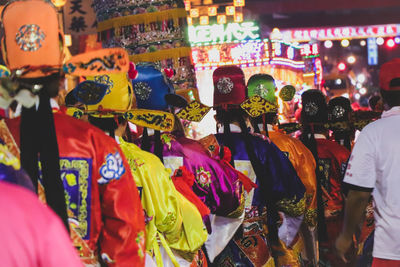 Rear view of people wearing traditional clothing during event