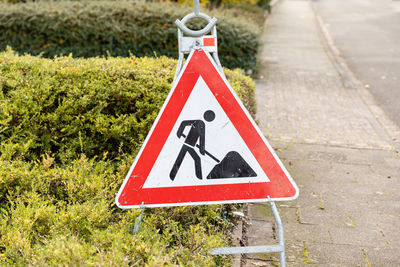 Warning sign on road