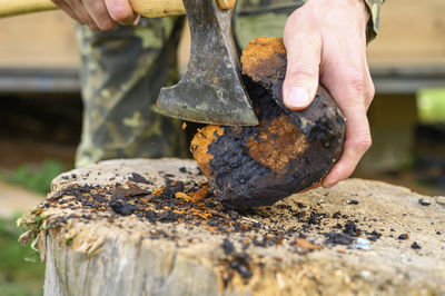 Close-up of man working on wood