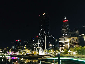 Illuminated buildings in city at night