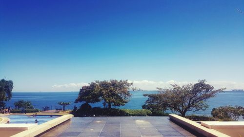 Scenic view of calm sea against blue sky