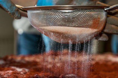 Close-up of person preparing food