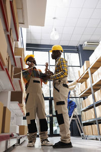 Low angle view of man standing in factory