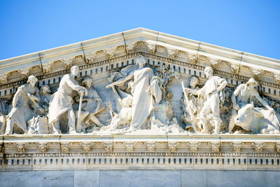 Low angle view of statue against sky