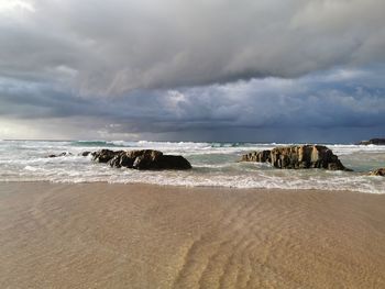 Scenic view of sea shore against sky