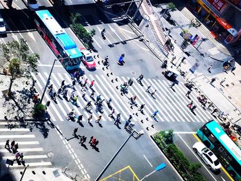 High angle view of people crossing road