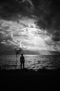 Scenic view of sea against cloudy sky