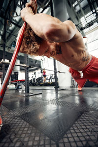 Low section of woman exercising in gym