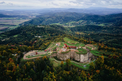 Srebrna gora fortress and sudety mountains at autumn season, aerial drone view